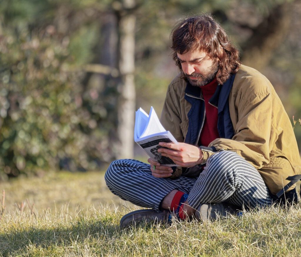 Lars is reading a book on his spare time in one of many Berlin parks